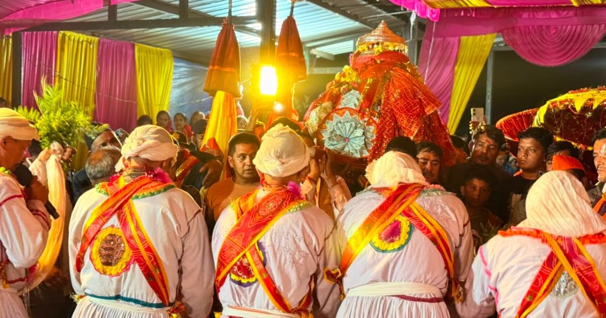 Maa Nanda Devi Badi Jaat Yatra 2026: Complete Travel Guide 7 Priests in traditional white robes gather around a decorated sacred idol.